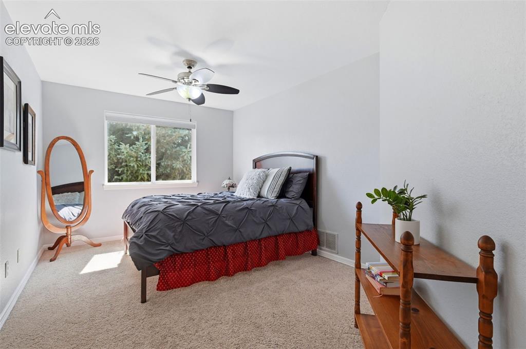 Image 39 of 50: A fourth bedroom upstairs with a walk-in closet
