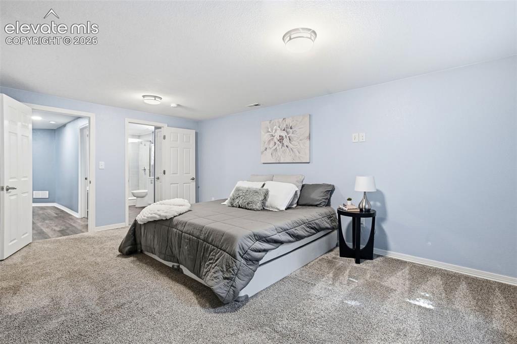 Image 44 of 50: This ensuite bedroom in basement is perfect for guests!