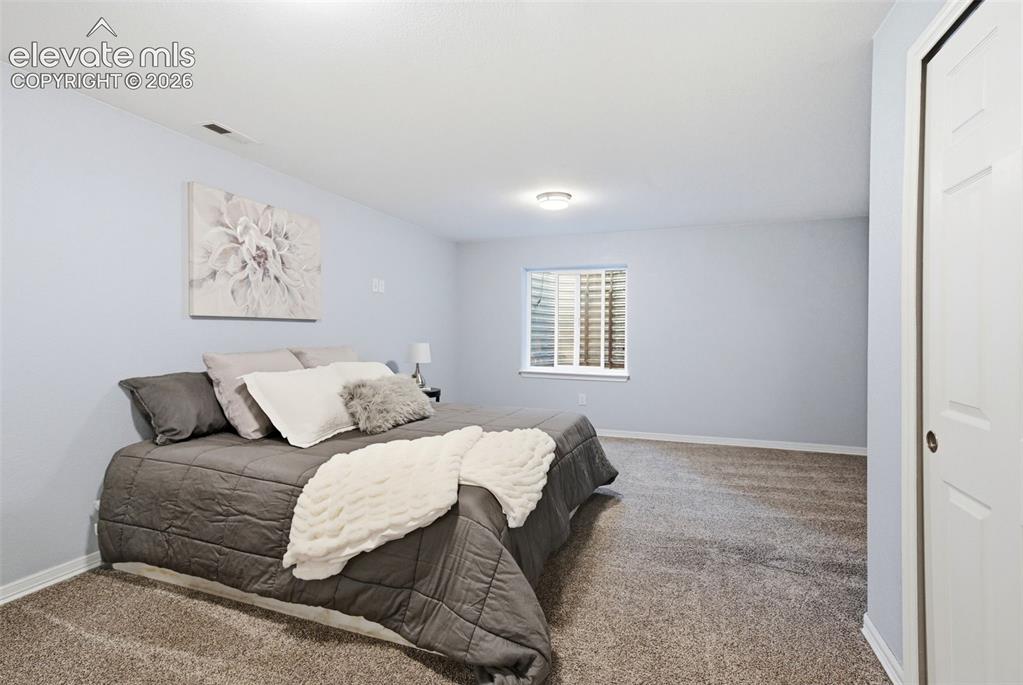 Image 45 of 50: A spacious bedroom basement is quiet for family or guests!