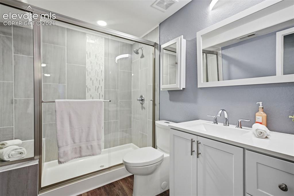 Image 46 of 50: A full private bath in basement bedroom.