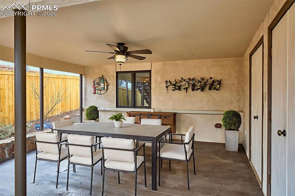 Image 45 of 50: Covered Patio – Spacious covered patio with ceiling fan and upgraded stampe