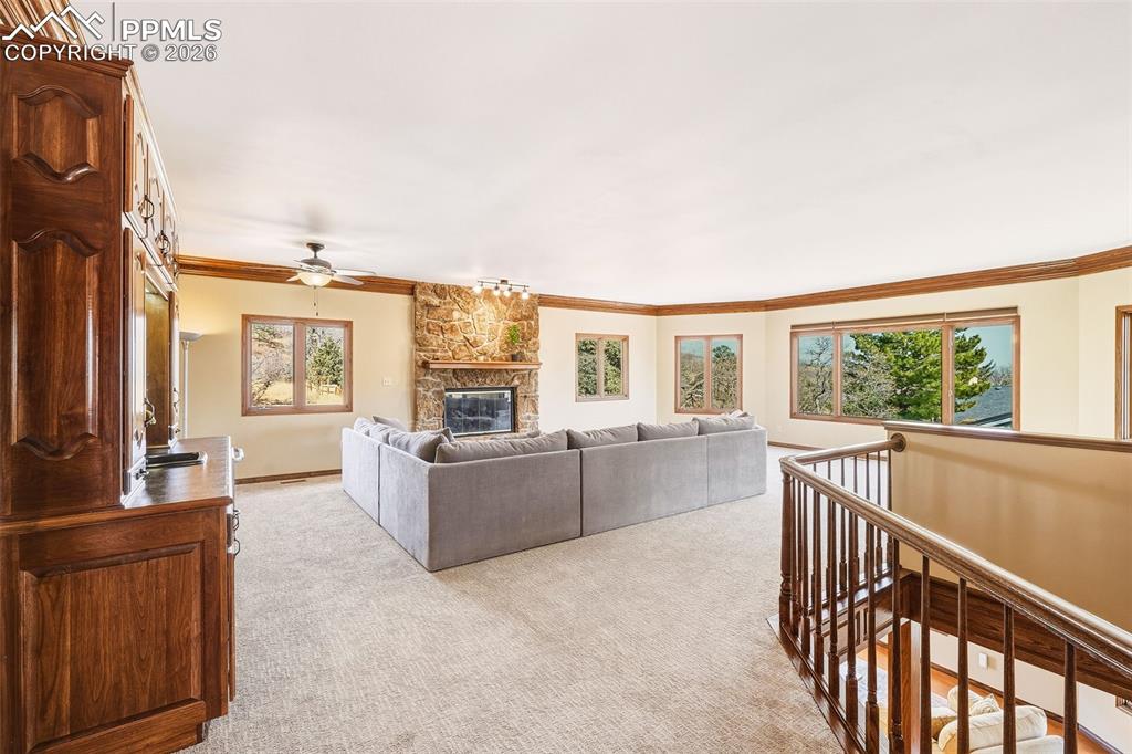 Image 6 of 50: Elevated position with railing detail and expansive windows offers peaceful