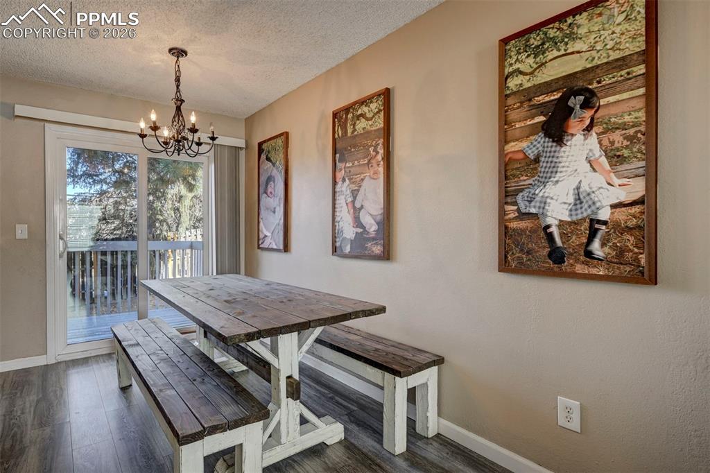 Image 10 of 31: The Dining Area is located off the Kitchen making it easy for food service 