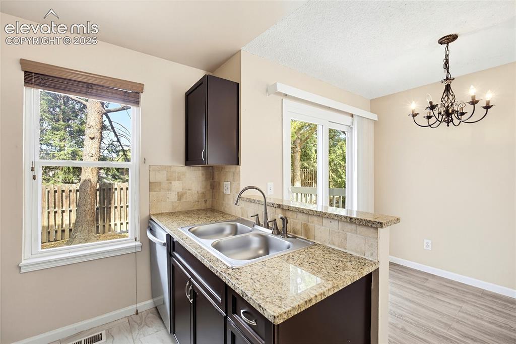 Image 10 of 31: View of the Dining Area from the Kitchen.