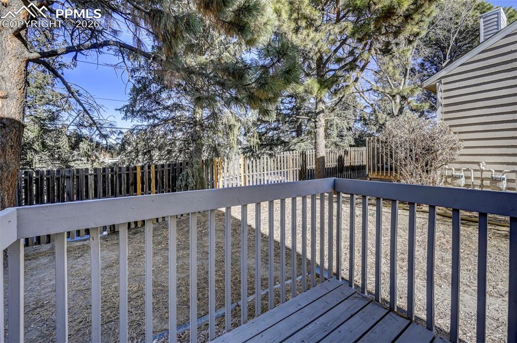 Image 13 of 31: Backyard deck for outdoor dining and relaxation.