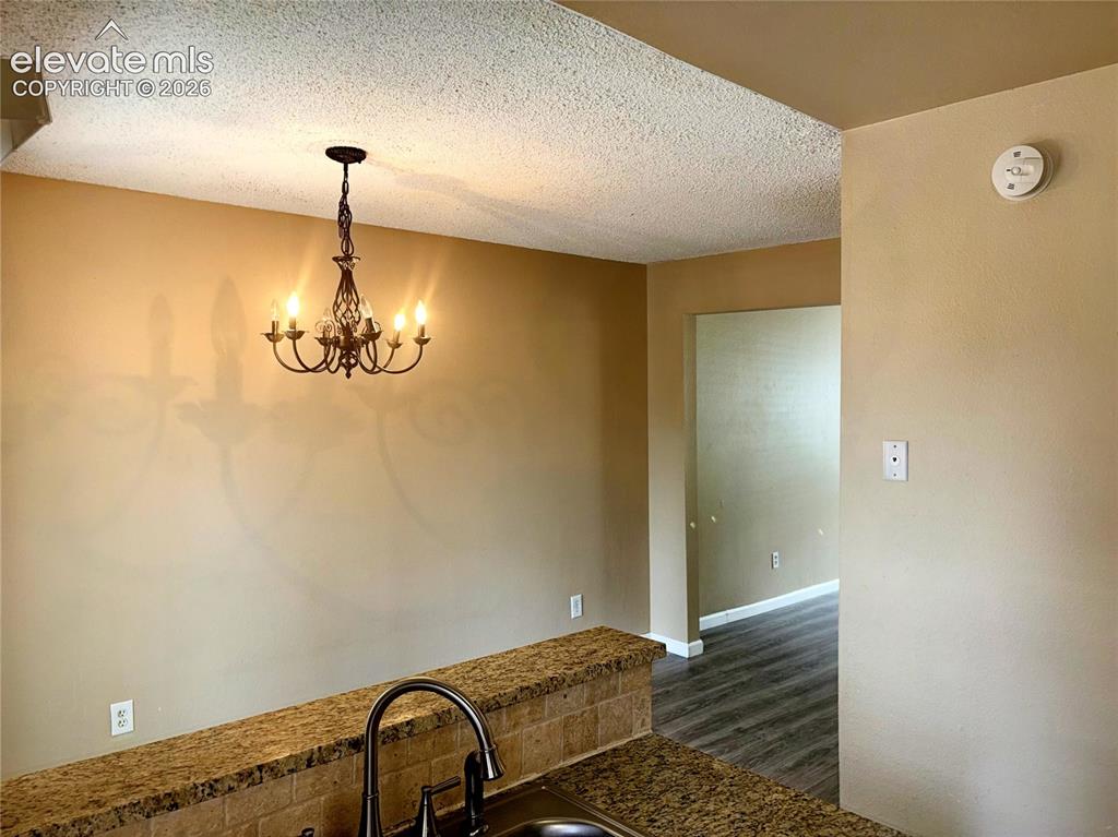Image 14 of 31: Dining Area with views into the Living Room.