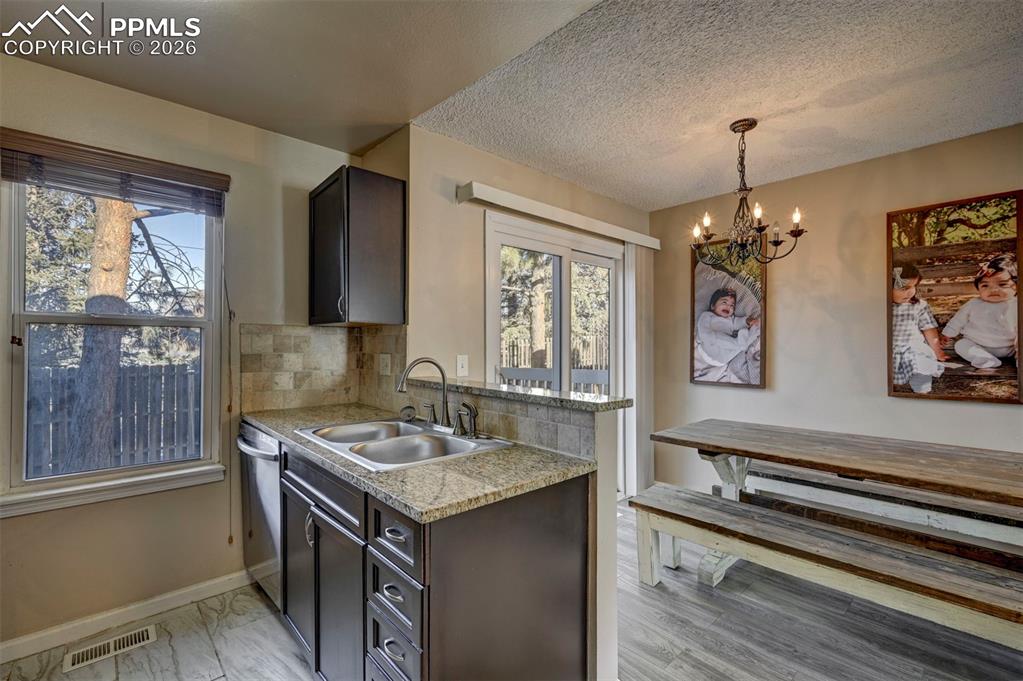 Image 17 of 31: View of the Kitchen into the Dining Area.
