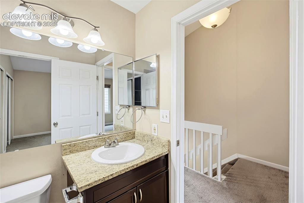 Image 20 of 31: Upper Level Bathroom with entry from the hallway and Primary Bedroom.