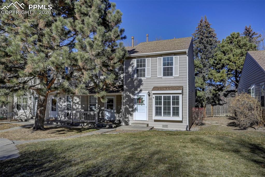 Image 27 of 31: Front view of the end unit townhome.