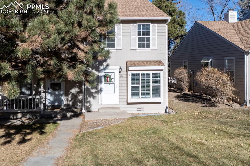 Image 3 of 31: Well maintained landscaping by HOA with mature trees for shade and privacy.