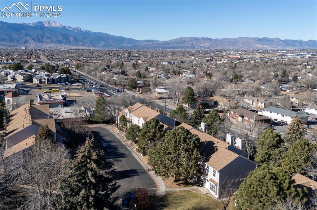 Image 30 of 31: Aerial view of townhome complex and mountain views.