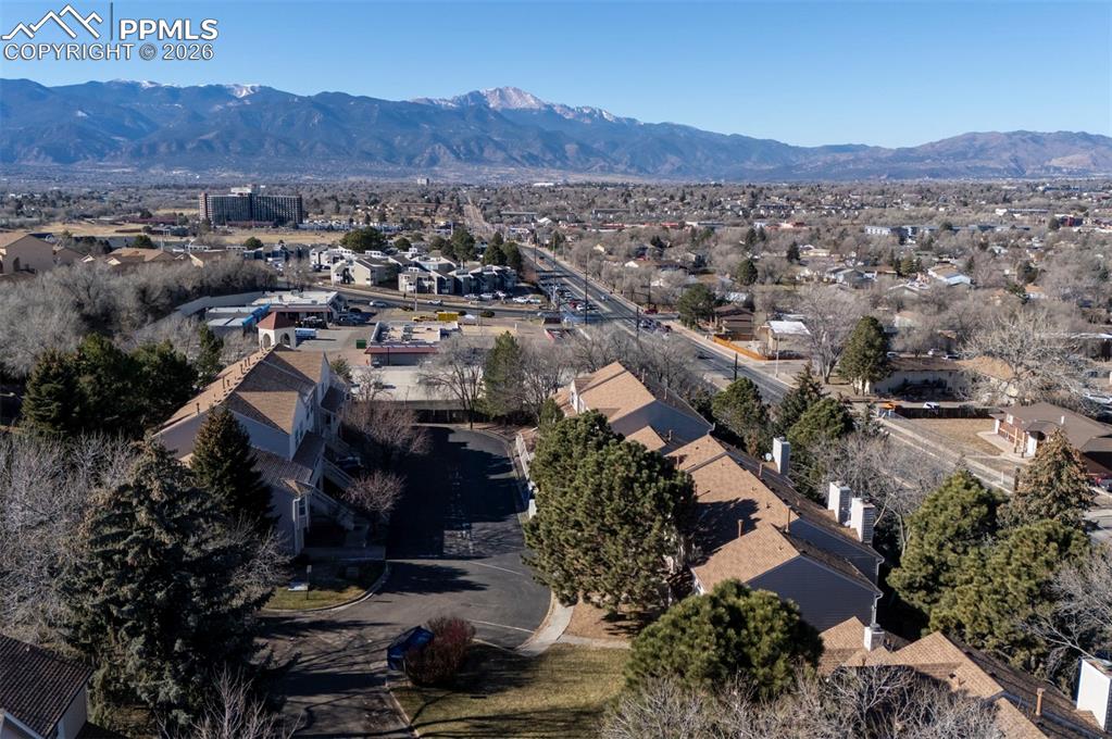 Image 31 of 31: Aerial view of townhome complex and mountain views.
