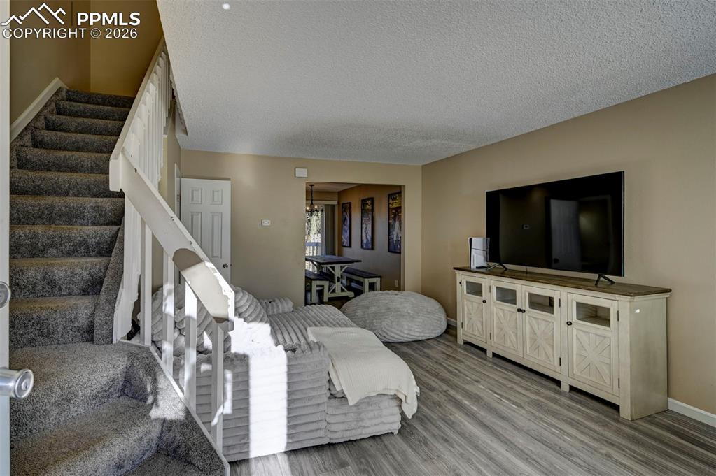 Image 4 of 31: LVP floors and warm paint tones in the Living Room.