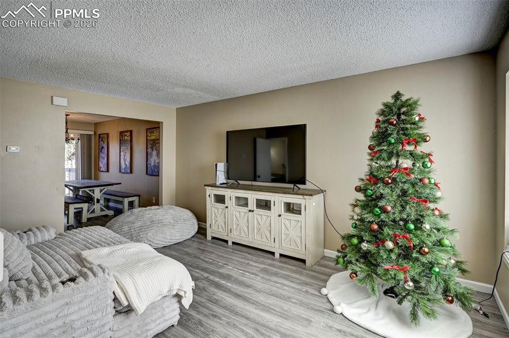 Image 5 of 31: The Living Room flows into the Dining Area and Kitchen, perfect for enterta