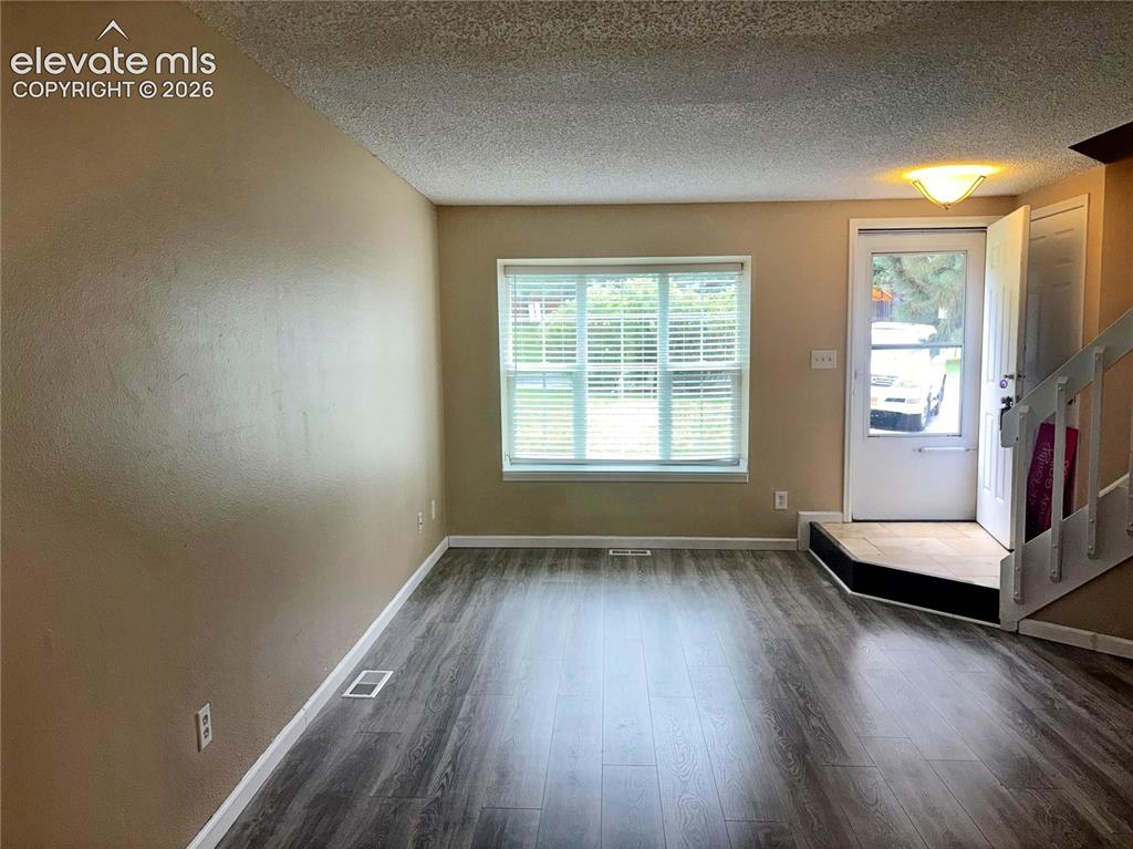 Image 5 of 31: LVP floors and warm paint tones in the Living Room.