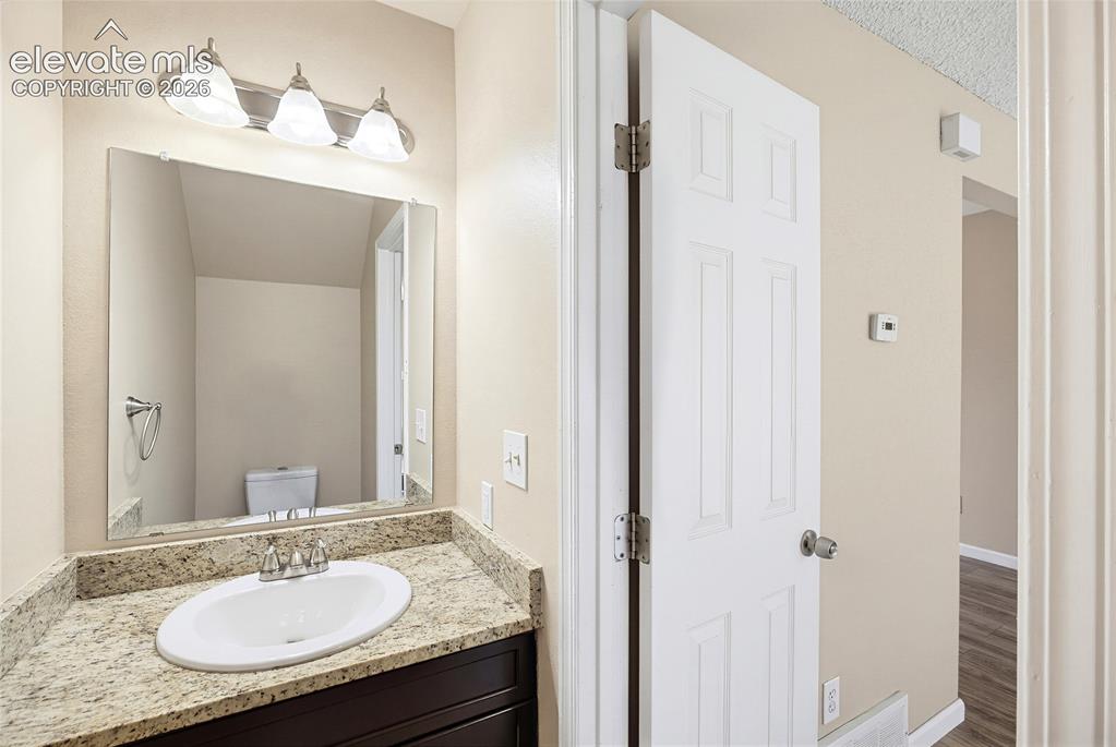 Image 6 of 31: Main Level Powder Bathroom.