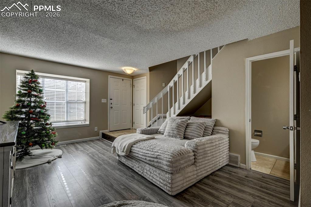 Image 8 of 31: Convenient Powder Bathroom located off the Living Room.