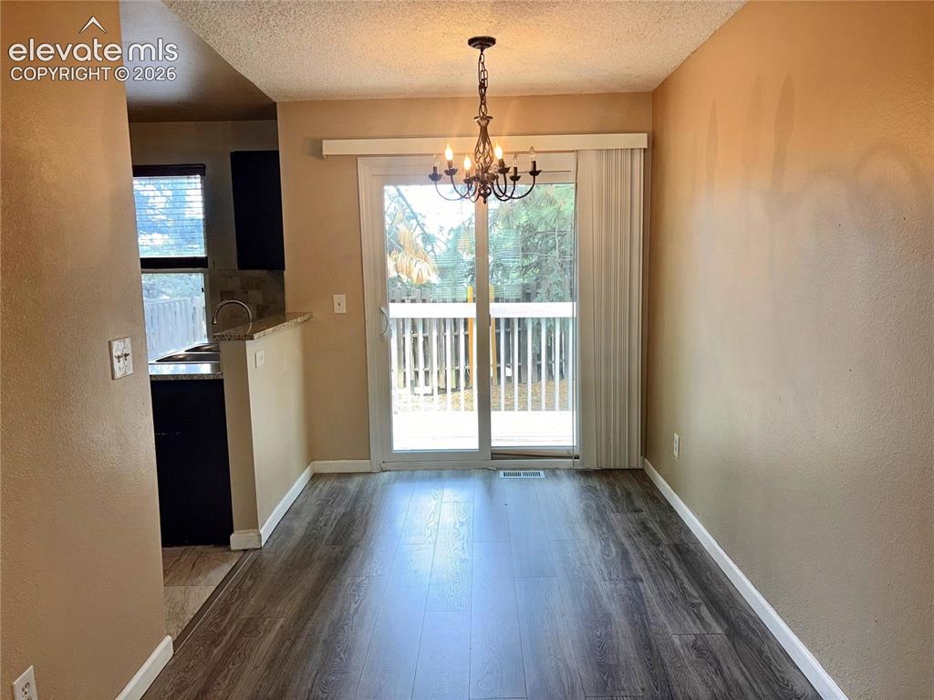 Image 8 of 31: The Dining Area is located off the Kitchen making it easy for entertaining
