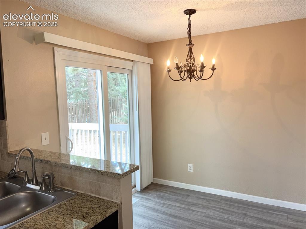 Image 9 of 31: Walk Out Dining Area to the backyard deck.