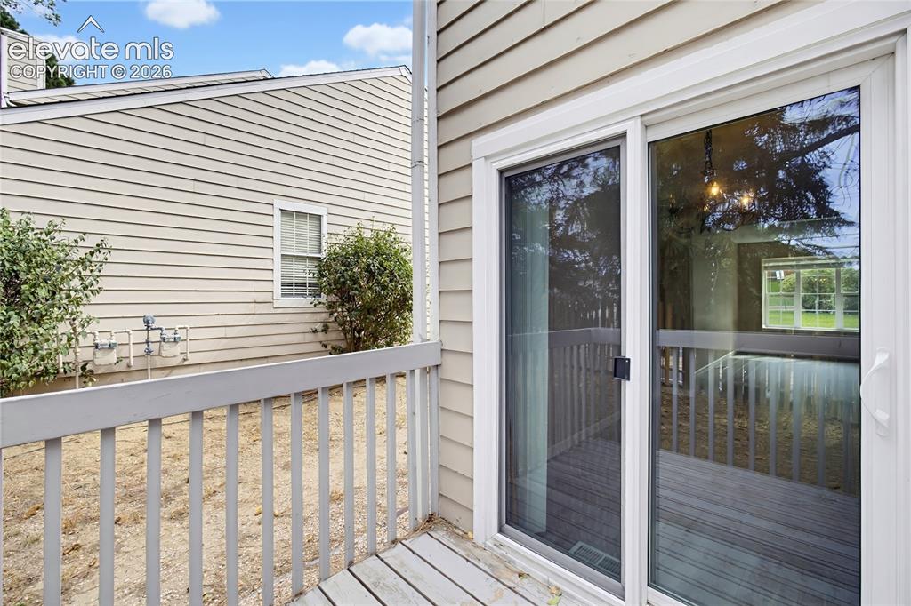 Image 9 of 31: Backyard deck for outdoor dining and relaxation.