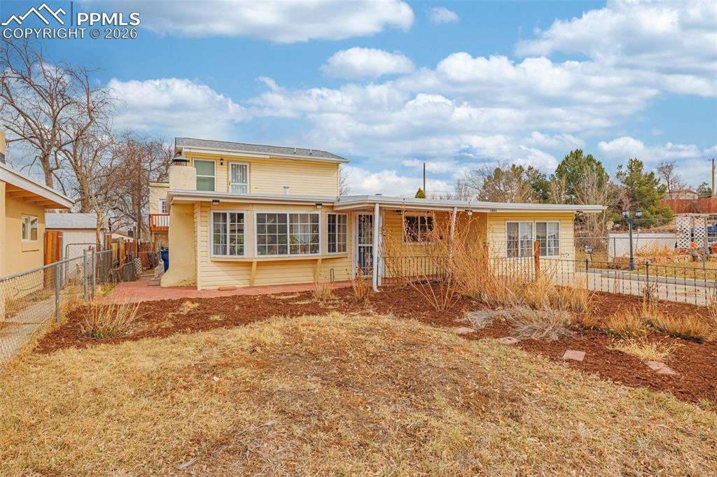 Image 1 of 38: Back of property with a patio area