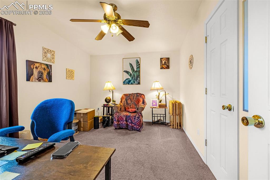 Image 31 of 38: ADU Office space/Bedroom 1 featuring carpet and a ceiling fan