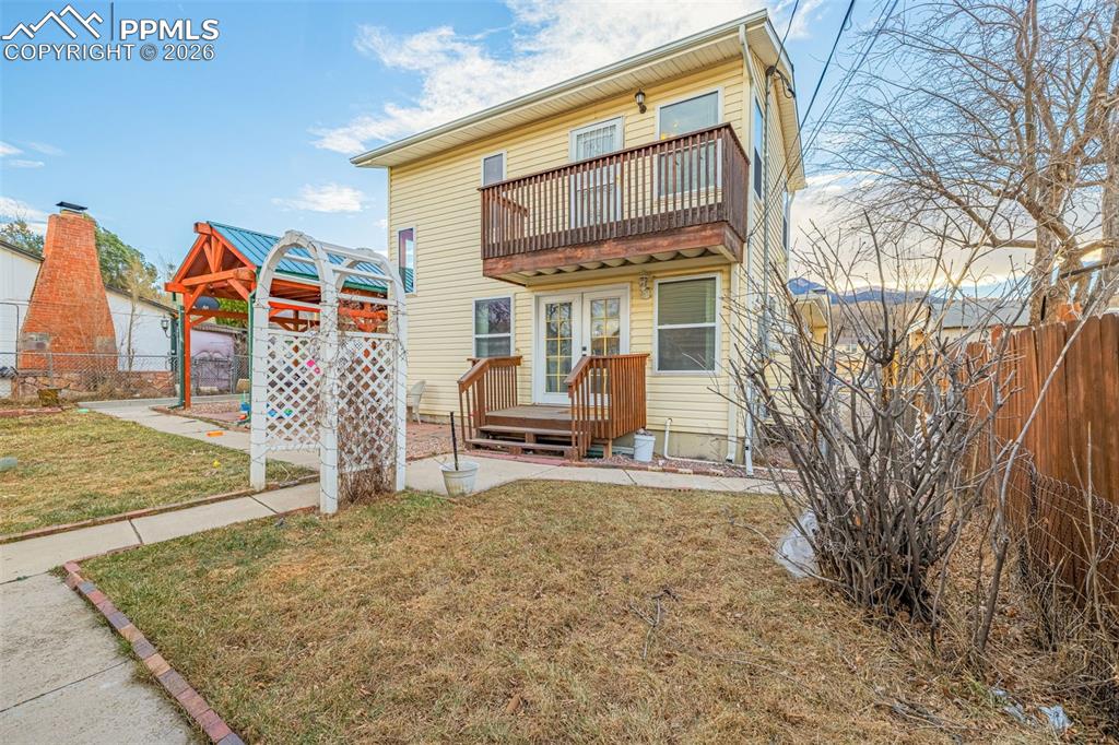 Image 35 of 38: Back of house with a patio and french doors