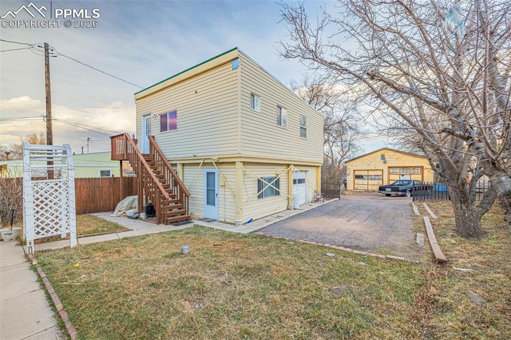 Image 38 of 38: View of ADU property exterior featuring stairway and asphalt driveway