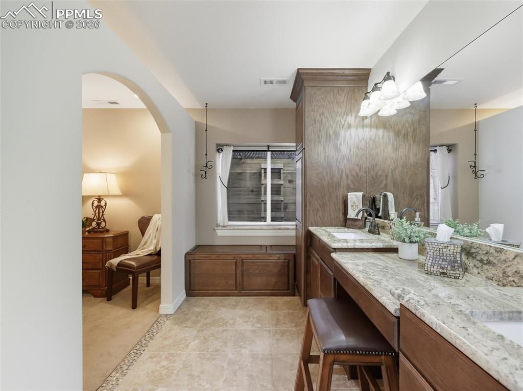 Image 31 of 50: Tons of built in storage. Check out the storage in the bench as well.