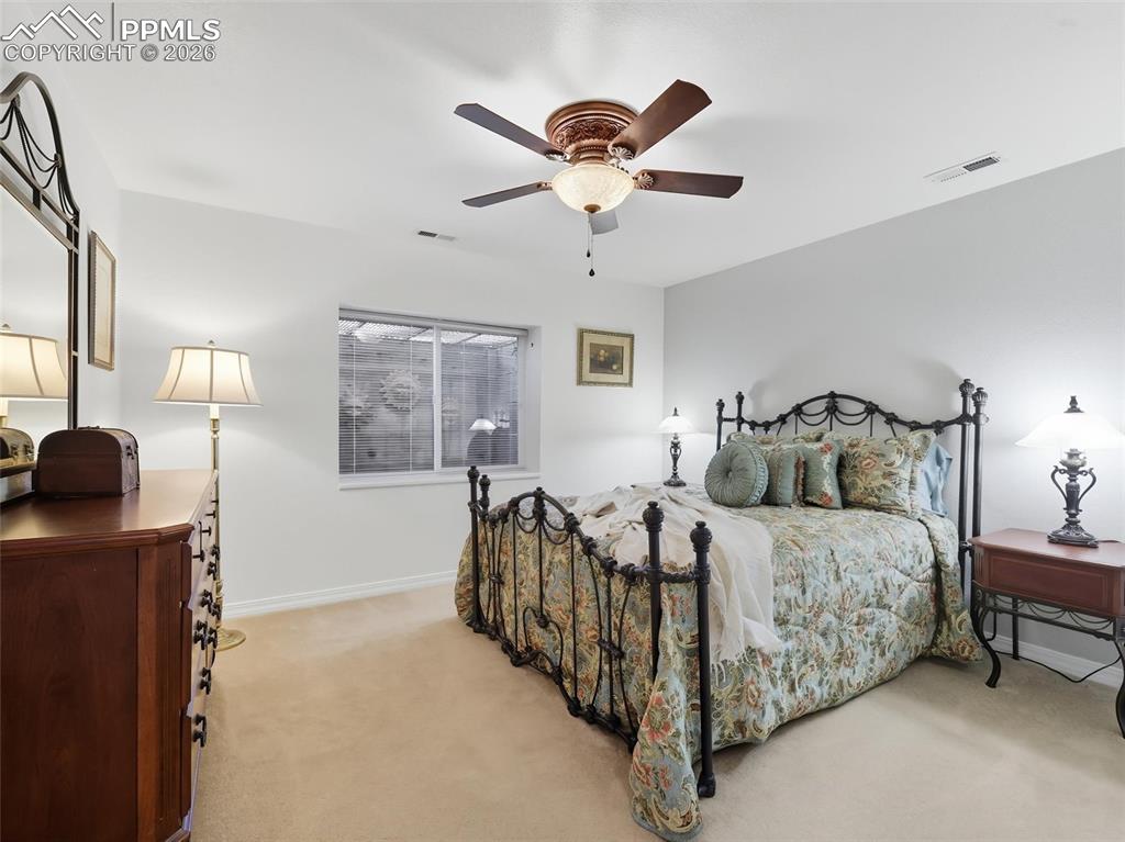 Image 32 of 50: This bedroom shares a bathroom with the other similar sized bedroom. These