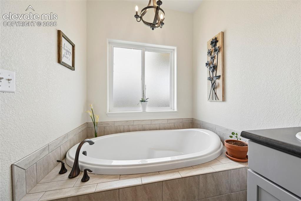 Image 25 of 50: Primary Bathroom with soaking tub