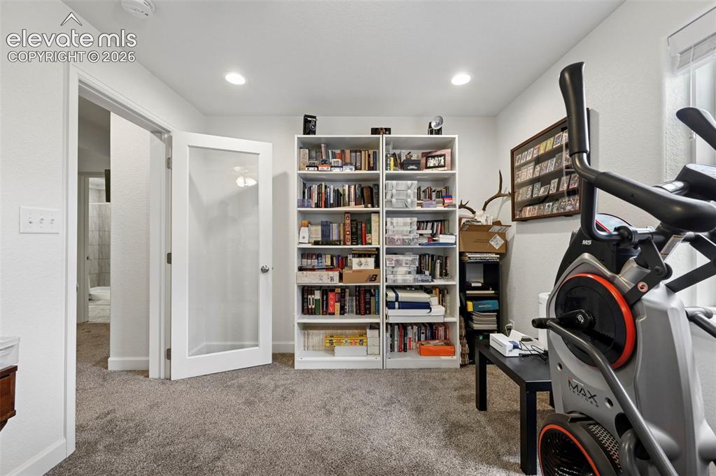 Image 31 of 50: Office in Basement with glass door
