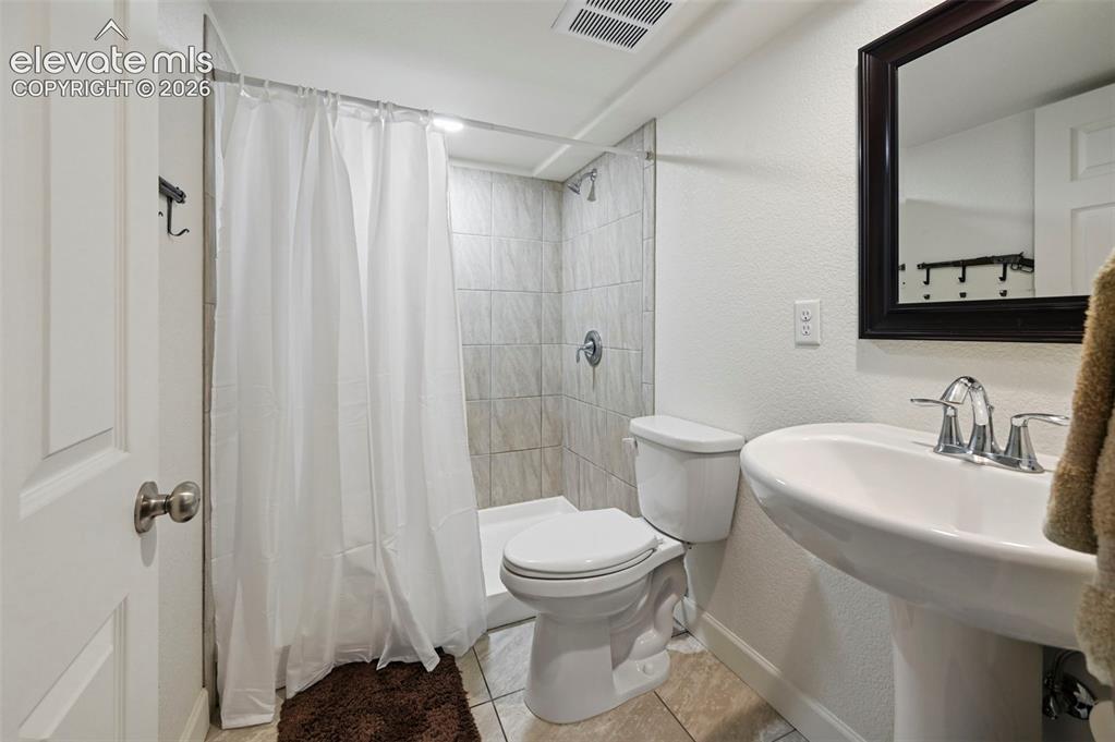 Image 33 of 50: 3/4 bathroom attached to Bedroom 5 in Basement