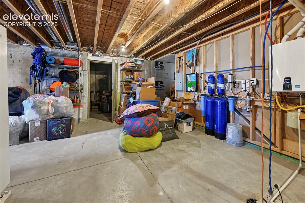 Image 38 of 50: Storage room with water filtration system