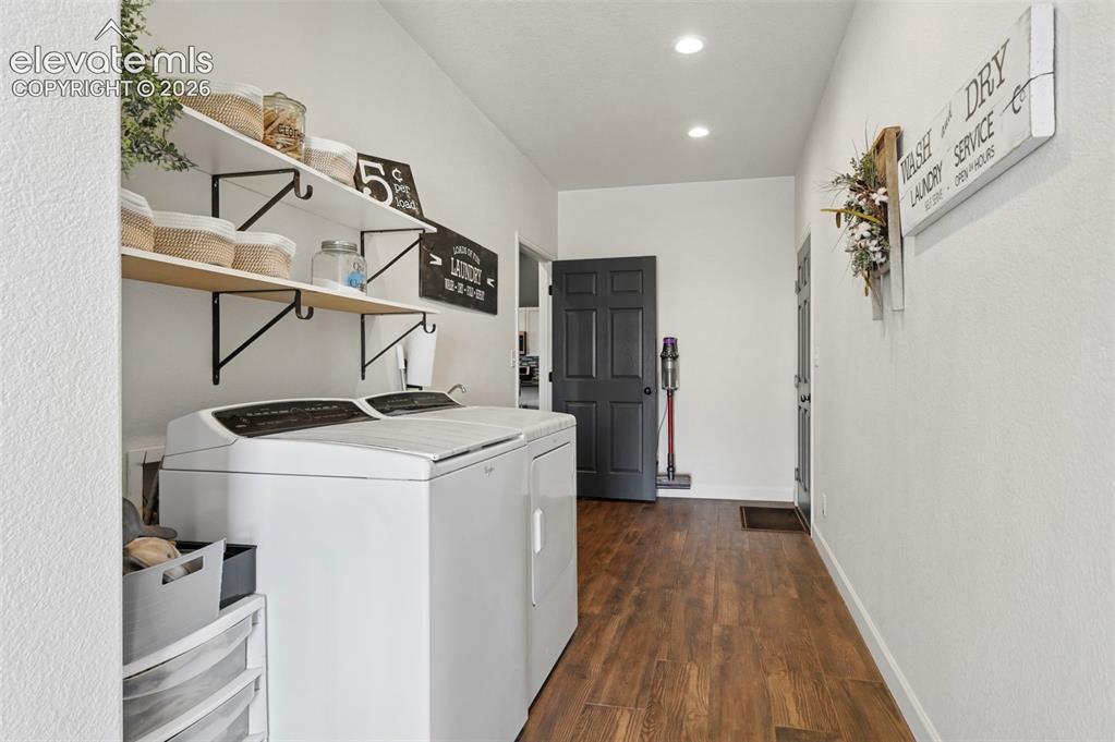 Image 4 of 50: Laundry Room with exterior and garage acces