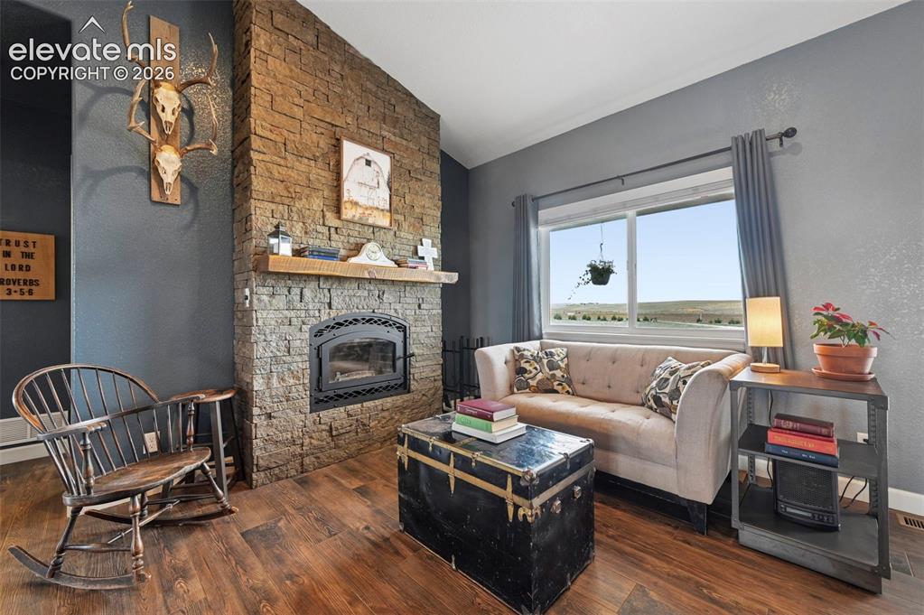 Image 8 of 50: Cozy Living Room with Fireplace
