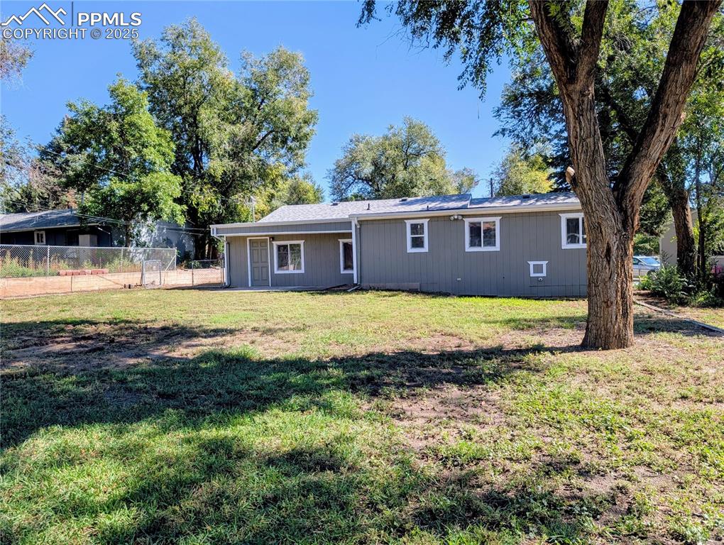 Image 40 of 48: Back of Home