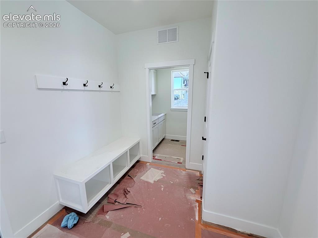 Image 21 of 42: Lower Level Bedroom 2 is a secondary Primary Suite with 3/4 Bath with Doubl
