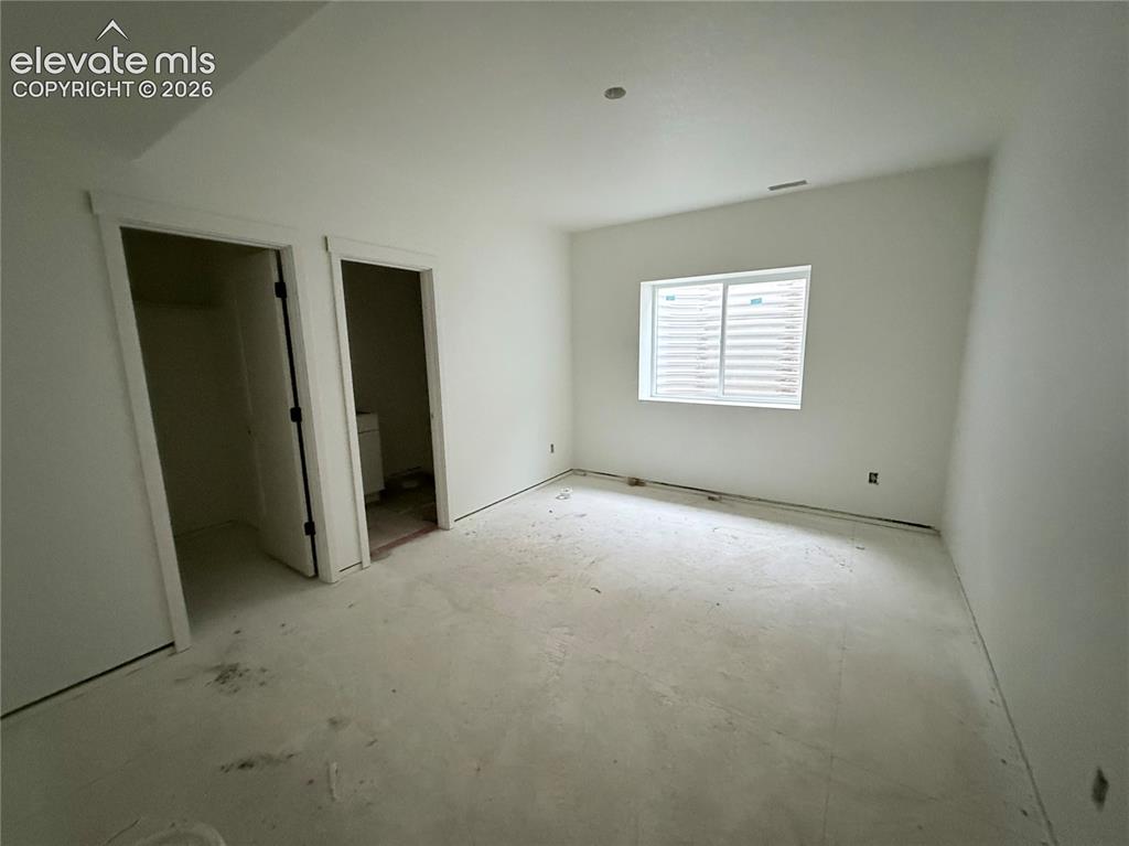 Image 24 of 47: Lower Level Bedroom 3 is a Jr. Suite with Private 3/4 Bath and Walk-in Clos
