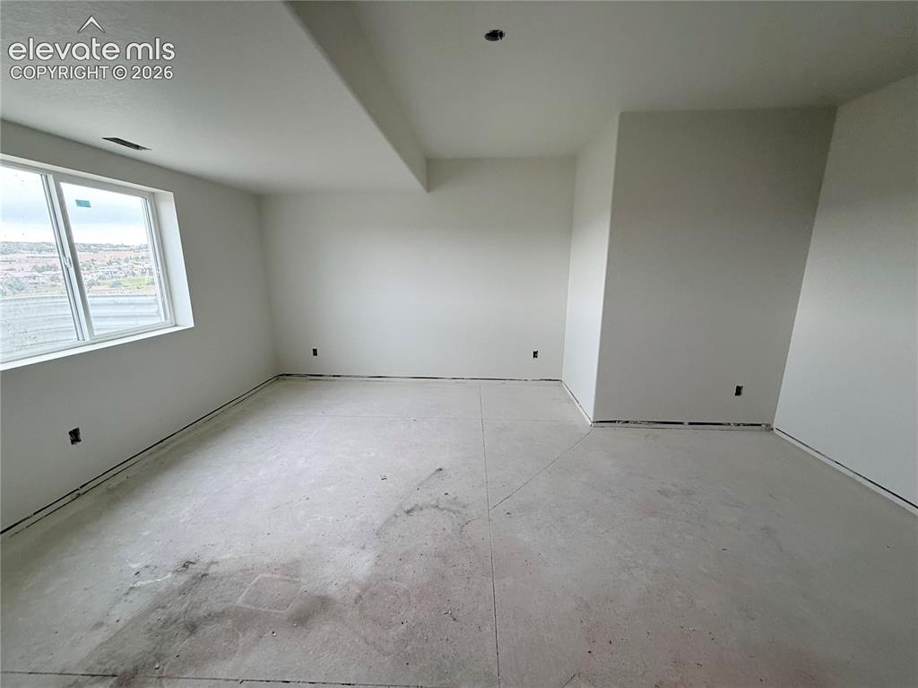 Image 29 of 47: Lower Level Bedroom 2 is a secondary Primary Suite with 3/4 Bath with Doubl
