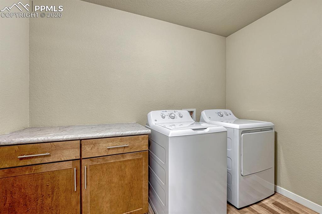 Image 15 of 50: Laundry room on the main level