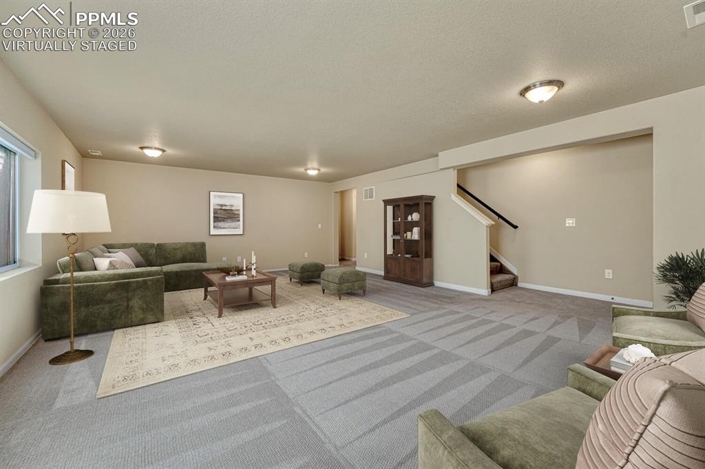 Image 18 of 50: Family room virtually staged