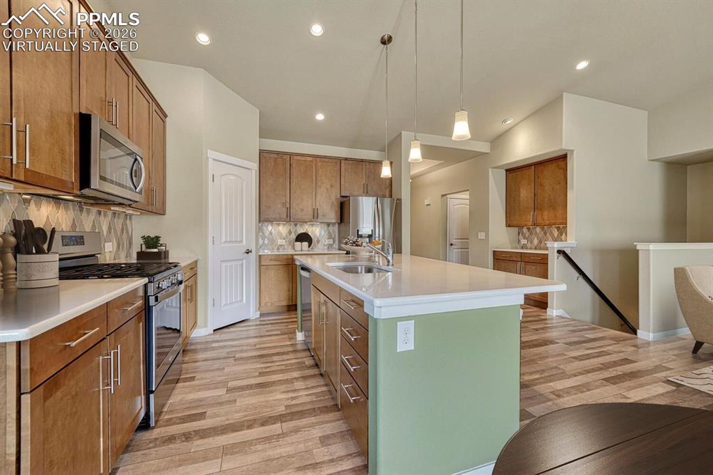 Image 7 of 50: Coffee bar extends the kitchen size. Virtually staged.
