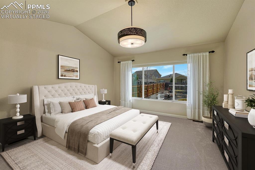 Image 9 of 50: Primary bedroom retreat has vaulted ceiling and en suite bathroom. Virtuall