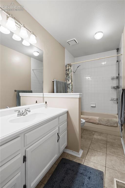 Image 24 of 43: White vanity with integrated sink, chrome faucet, and dark hardware