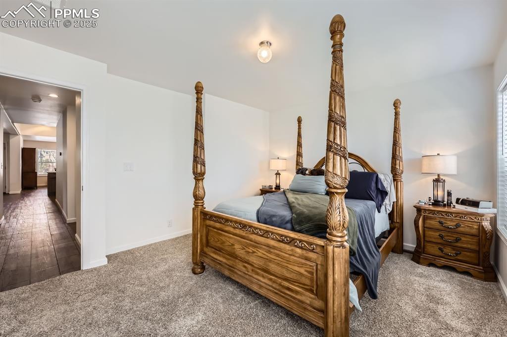 Image 15 of 28: Bedroom with carpet and baseboards