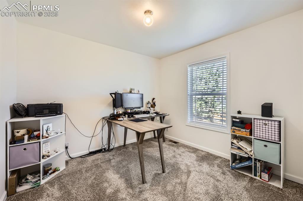 Image 22 of 28: Carpeted office featuring baseboards