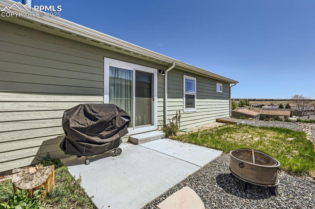 Image 27 of 28: View of patio / terrace featuring a fire pit and grilling area