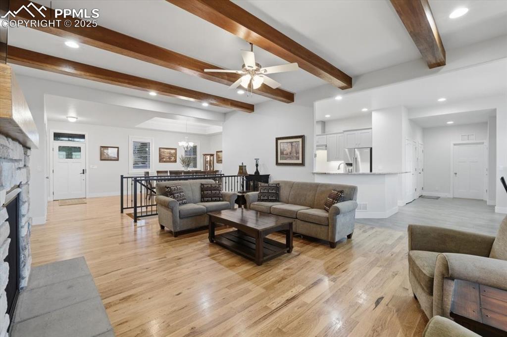 Image 12 of 49: This home is bright and inviting thanks to oversized widows, recessed can l