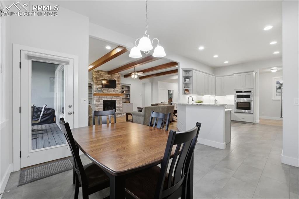 Image 17 of 49: The informal dining area is open to the deck and kitchen.